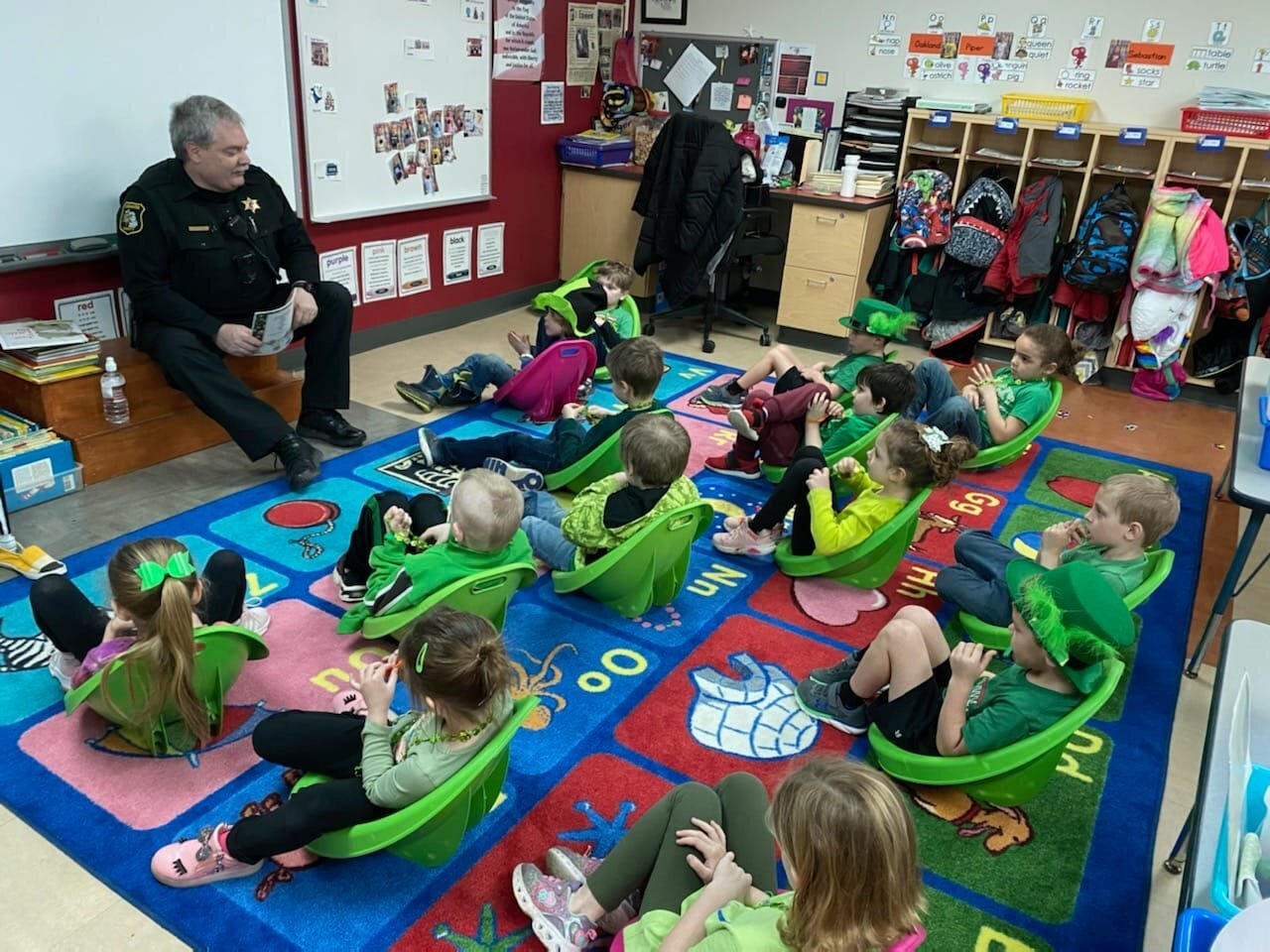 Police Officer Reading to Students
